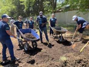 Volunteers helping plant an orchard at Catawba