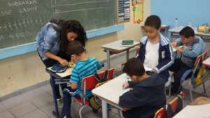 Helping a boy make a mask