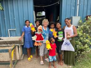 Val Hilliker puppet visit with Koroipita children