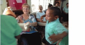 Giving a hug to Lily the duck