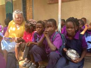 HATW Volunteer, Jenny, with children at Pizz