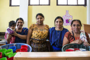 Gricelda Standing with the Preschool's Teachers
