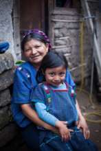 Magdalena and Rosa in front of the family's home