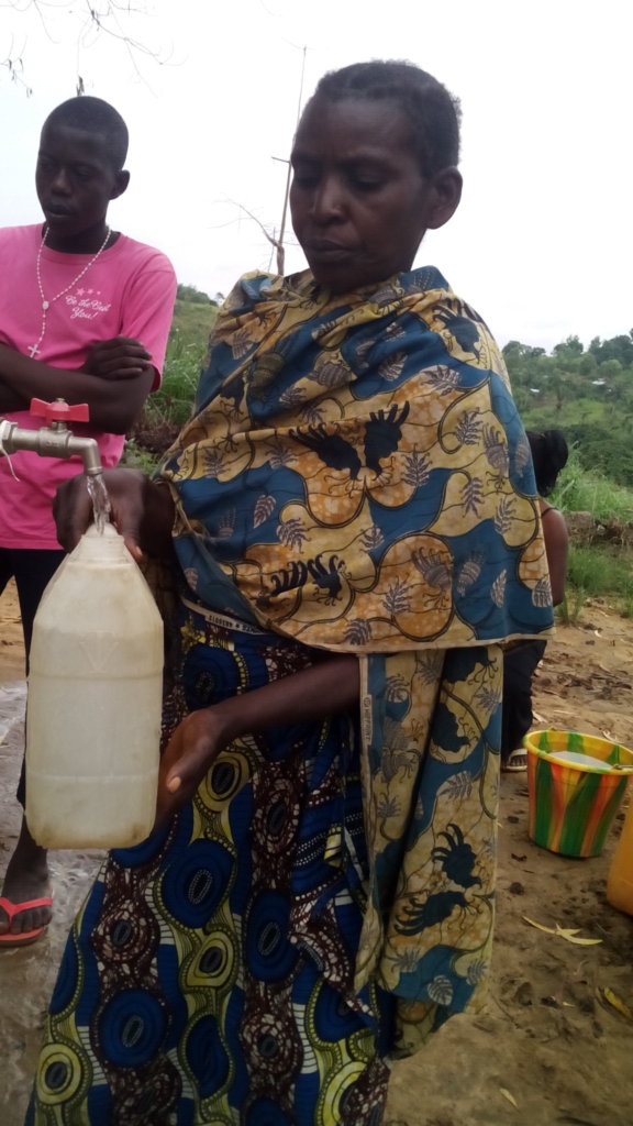Woman filling her container.