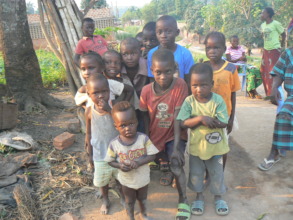 village children gather around