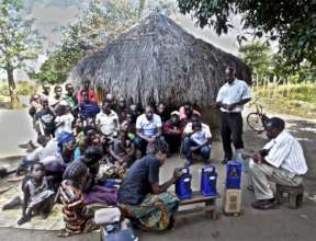 Filius (far right) & Nbabile demonstrating MP3s