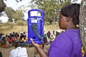 Listening group leader, Mabel, with Prime radio