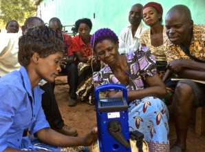 Ndabile demonstrating a Lifeplayer to farmer