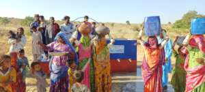 Women After Filling their Pots with Water