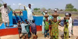 Children Happy after filling their Pots with Water