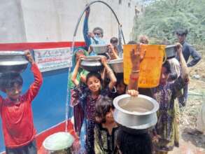 Girl With Her Pitcher Full of Safe Drinking Water