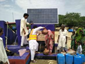 Water pitcher being filled.