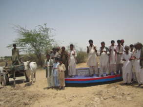People are happy to get fresh water from new well.