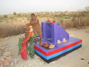 Children getting water from the new water well.