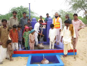Delight of having fresh water from a new well.