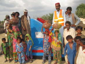 The  women and children with filled water pots.