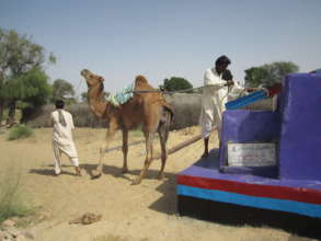 Water being drawn from well.