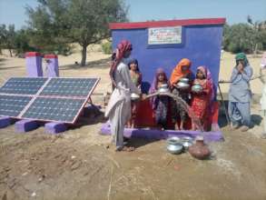 Children Filling their Pots with Water