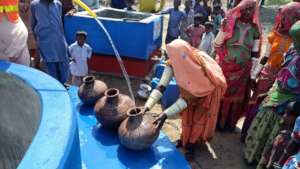 Women Filling their Pots with Sweet Water