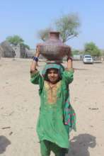 little girl have to carry water for miles