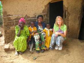 Outside her home with her siblings