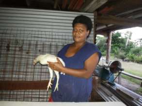 Miriama of Naicavecabe Village with her chickens