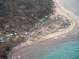 A community on Koro wiped out by storm waves.