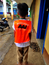 New mini-nurse wearing uniform vest from AAI