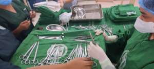 Student nurses help prepare surgical instruments