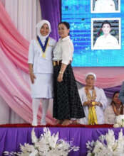 Student on stage during ceremony