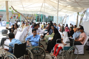Applicants wait with their guardians