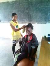 Slyvia in Yellow working on a community lad