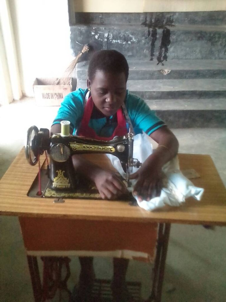 Ruulu working on tailoring machine