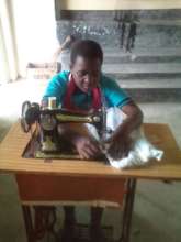 Ruulu working on tailoring machine
