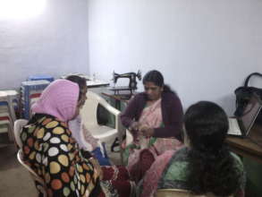 MEERA DEMONSTRATING REFLEXOLOGY ON VIDYA'S TOES