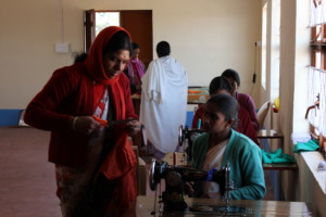 Lessons on tailoring for village women by ET staff