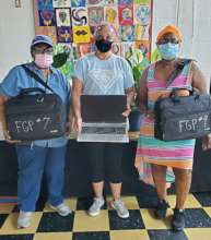 Foster Grandparents picking up their Laptops