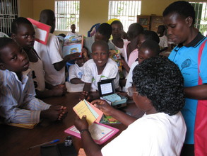 Kids checking out books at their new library