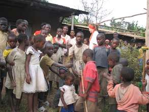 Children showing WMI staff the village