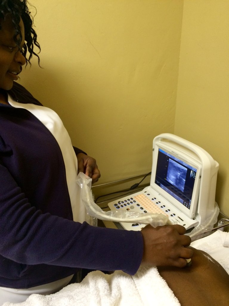 Nurse doing an ultrasound screening