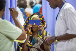 Patient at CCBRT in triage for eye treatment