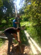 Volunteers and Staff Securing the Poles