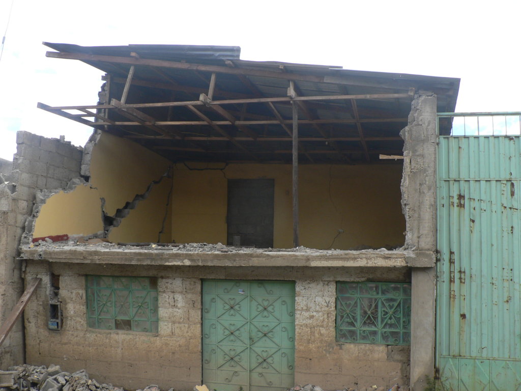 Houses close to the pit are destroyed by explosion