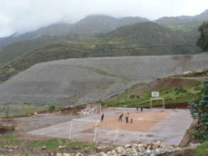 Playing soccer near the open pit mine