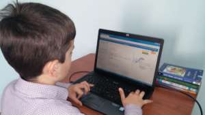 Alex, a 9-year-old 2nd grader, using Khan Academy