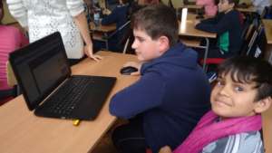 School boys using Khan Academy at 137th School