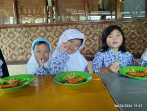 The preschoolers enjoy their meals