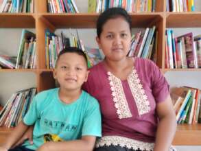 Rijal and his mother at the library