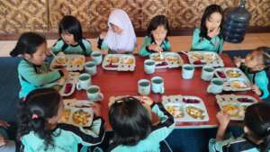 The girls enjoy their food