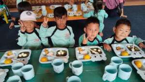 The boys enjoy their food